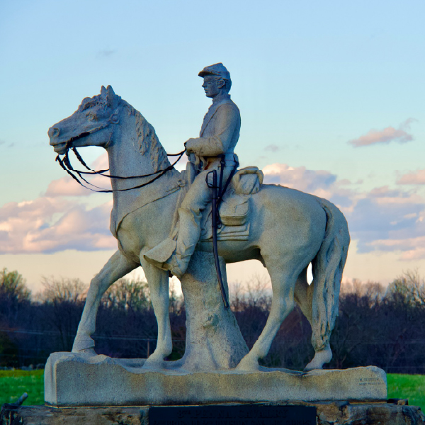 a statue of a person riding a horse